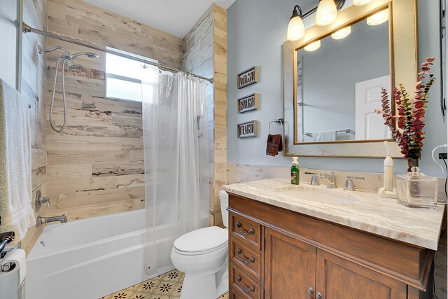 full bath featuring toilet, shower / bath combo, and vanity