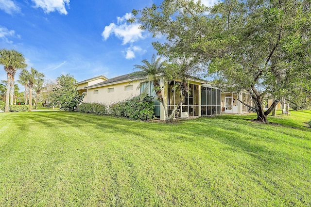 view of yard featuring a sunroom