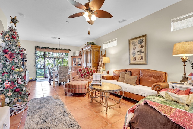 tiled living room featuring ceiling fan