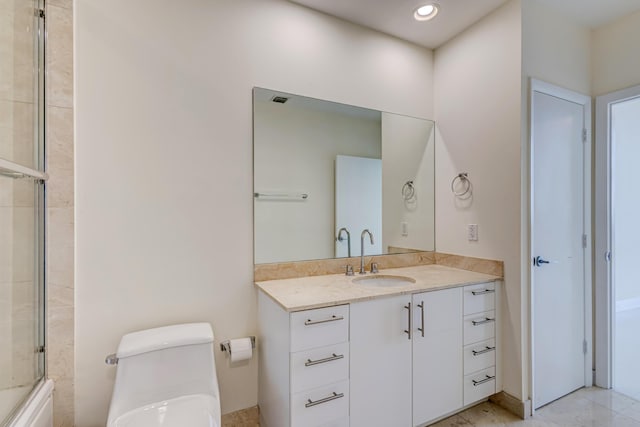 full bathroom featuring toilet, vanity, and combined bath / shower with glass door