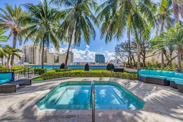 view of swimming pool featuring a community hot tub