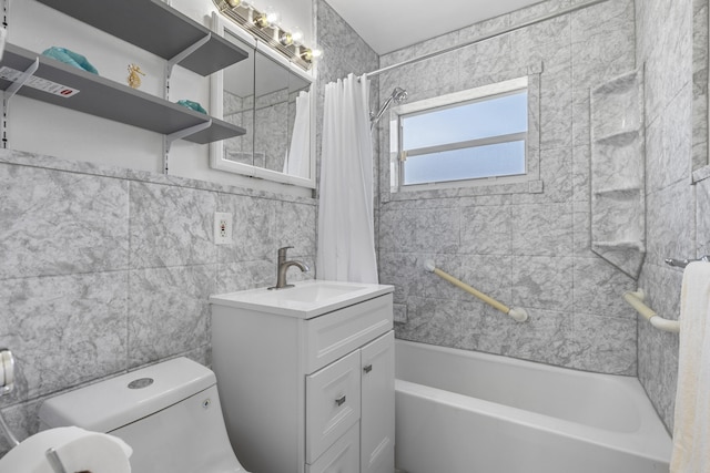 full bathroom with tile walls, vanity, toilet, and shower / bath combo with shower curtain