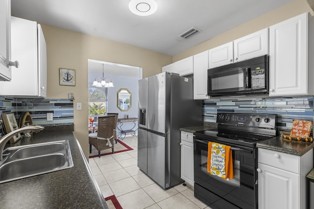 kitchen with sink, tasteful backsplash, white cabinetry, a chandelier, and black appliances