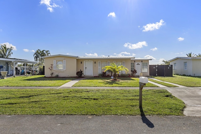 single story home featuring a front yard