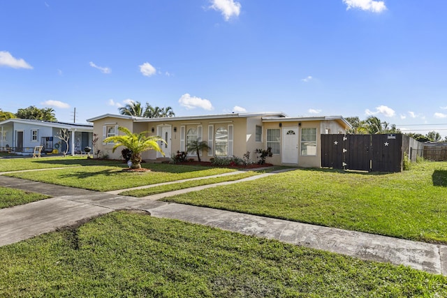 single story home with a front lawn