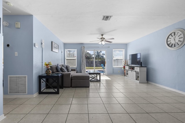 living room with light tile patterned floors and ceiling fan