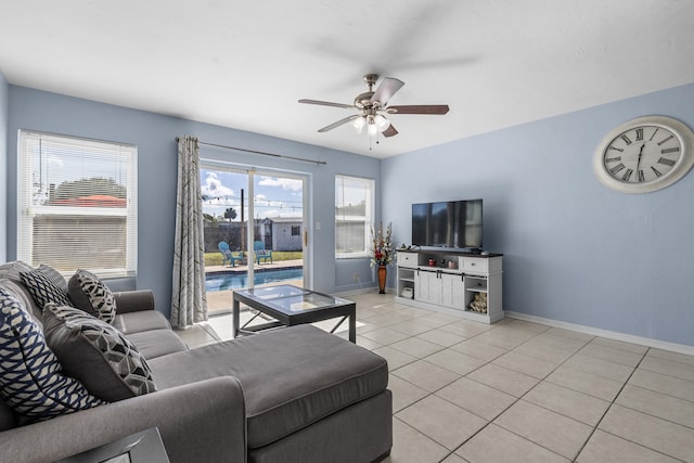 living room featuring light tile patterned flooring and ceiling fan