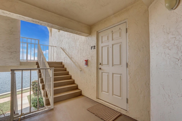 property entrance featuring a water view