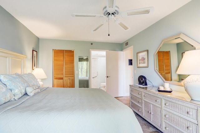 bedroom featuring ensuite bathroom and ceiling fan