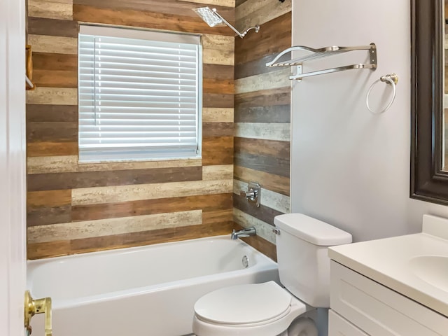 full bathroom with bathing tub / shower combination, vanity, and toilet