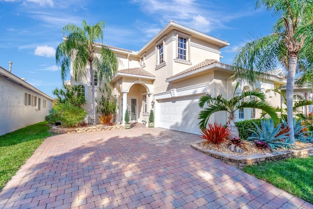 mediterranean / spanish-style house featuring a garage