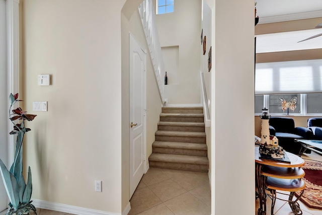 stairs featuring tile patterned flooring and a wealth of natural light