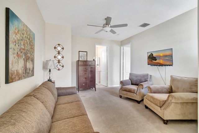 carpeted living room featuring ceiling fan