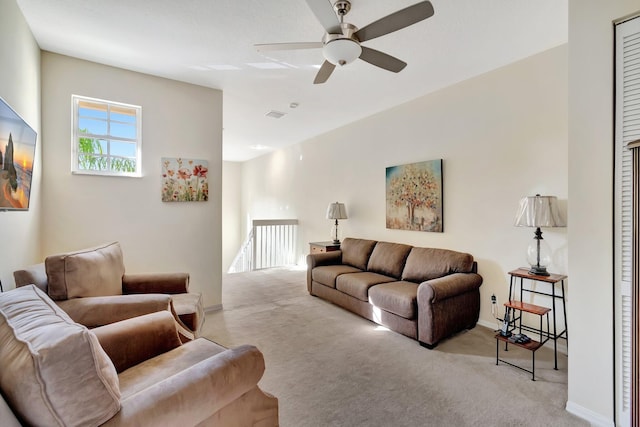 living room featuring light carpet and ceiling fan