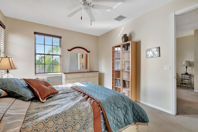 bedroom with light carpet and ceiling fan