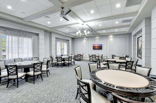 dining room with light carpet, beamed ceiling, ceiling fan with notable chandelier, and coffered ceiling