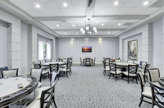 carpeted dining area featuring beam ceiling and an inviting chandelier