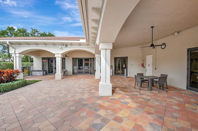 view of patio featuring ceiling fan and french doors