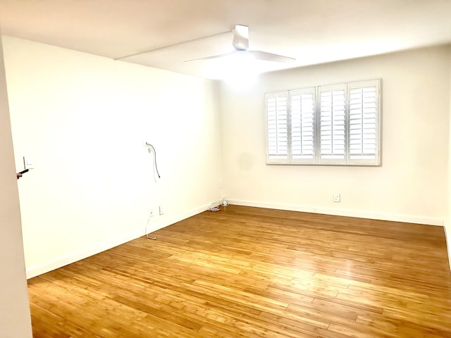 spare room with ceiling fan and light hardwood / wood-style floors