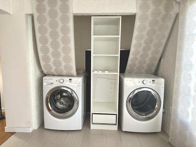 washroom with washer / clothes dryer