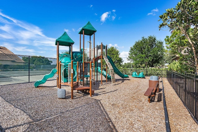 view of jungle gym featuring tennis court