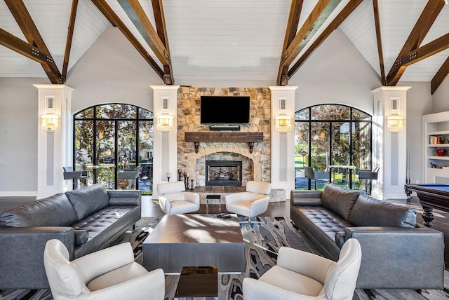 living room featuring a fireplace, beam ceiling, hardwood / wood-style flooring, and high vaulted ceiling