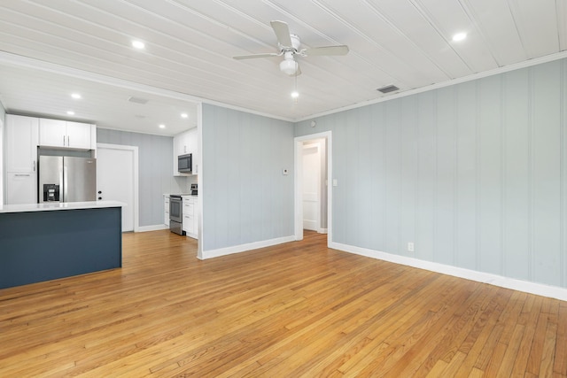 unfurnished living room with ceiling fan, light wood-type flooring, and ornamental molding