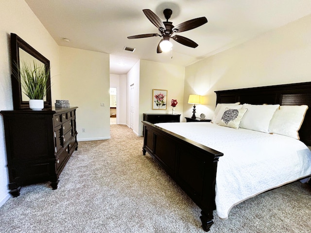 bedroom featuring light carpet, ceiling fan, visible vents, and baseboards