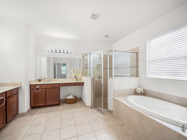 bathroom featuring visible vents, vanity, a shower stall, tile patterned flooring, and a bath