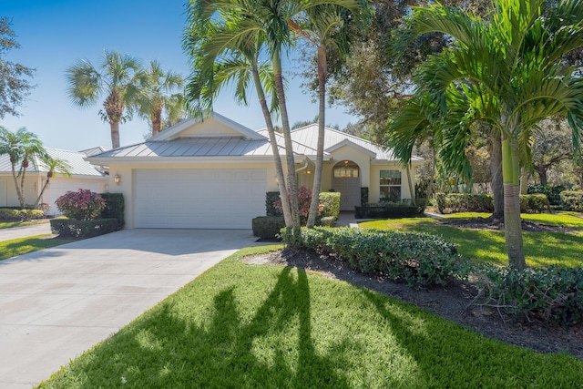 ranch-style house featuring a front yard and a garage