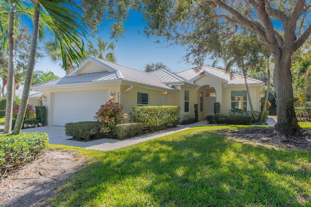 single story home with a garage and a front yard