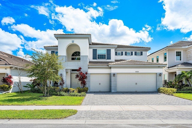 view of front facade featuring a front yard and a garage