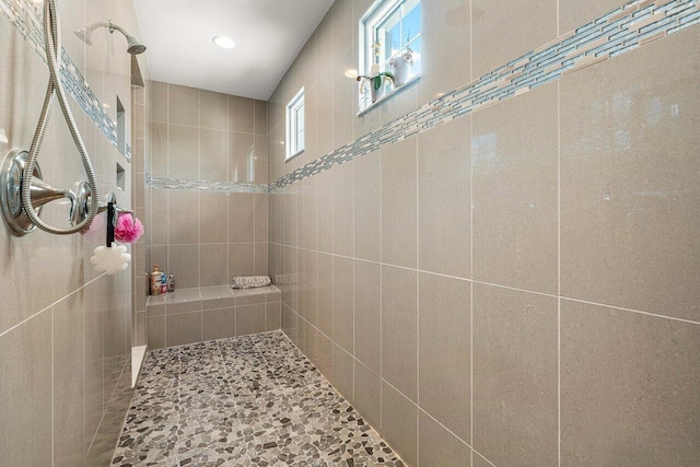 bathroom with tiled shower