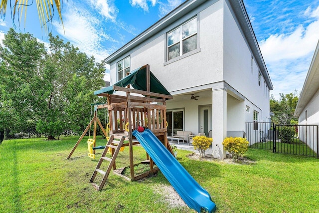 view of play area featuring a yard and a patio