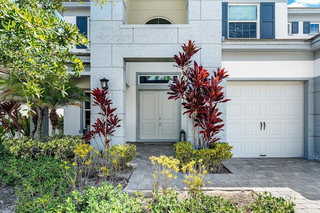 view of exterior entry featuring a garage