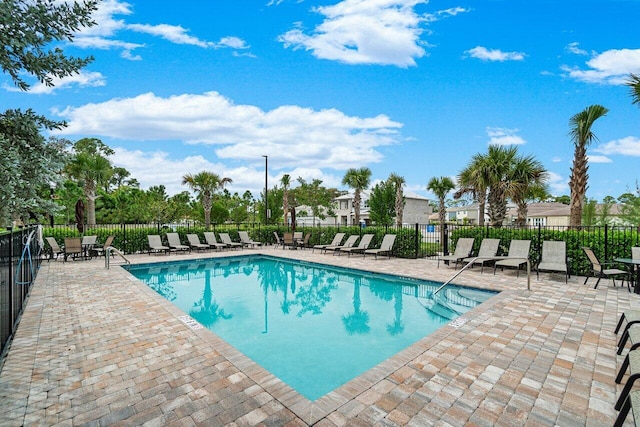 view of swimming pool with a patio