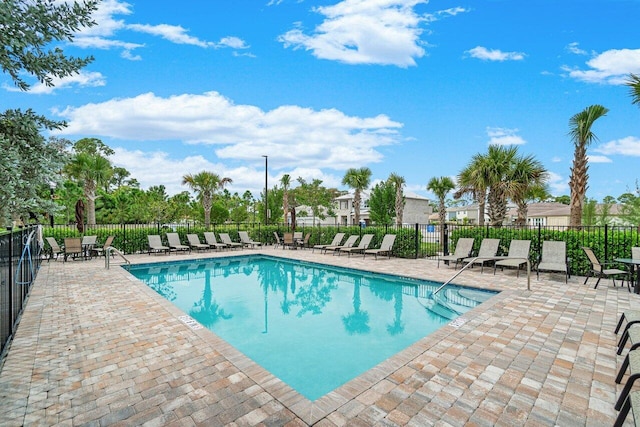 view of swimming pool with a patio area