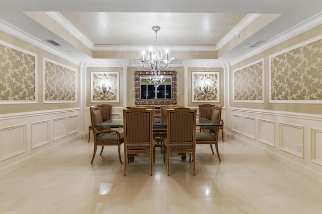 dining room with a tray ceiling, a chandelier, and ornamental molding