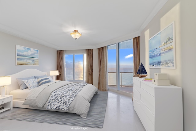 bedroom with access to exterior, crown molding, and a water view