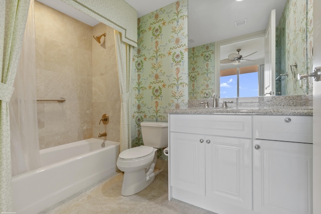 full bathroom featuring ceiling fan, vanity, shower / bath combination with curtain, and toilet