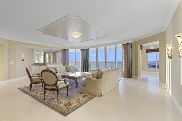 living room with floor to ceiling windows, crown molding, and a water view