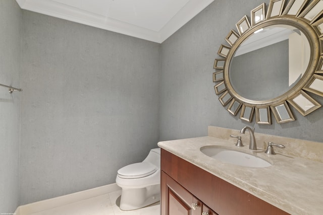 bathroom with tile patterned flooring, vanity, toilet, and ornamental molding