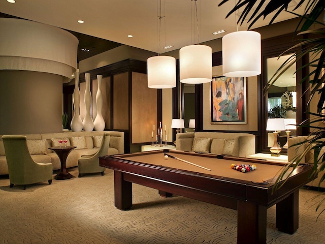 recreation room with light colored carpet and pool table