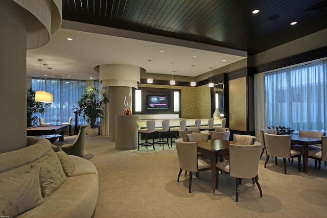 dining room featuring light carpet