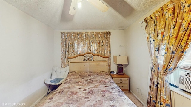 bedroom with carpet flooring, a textured ceiling, and ceiling fan