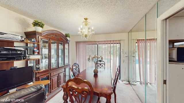 carpeted dining area featuring a textured ceiling and a chandelier