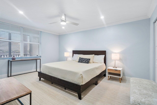 bedroom featuring ceiling fan and ornamental molding