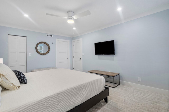 bedroom with ceiling fan and light colored carpet