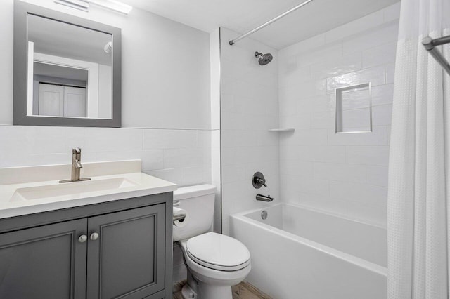 full bathroom with decorative backsplash, vanity, shower / tub combo with curtain, tile walls, and toilet