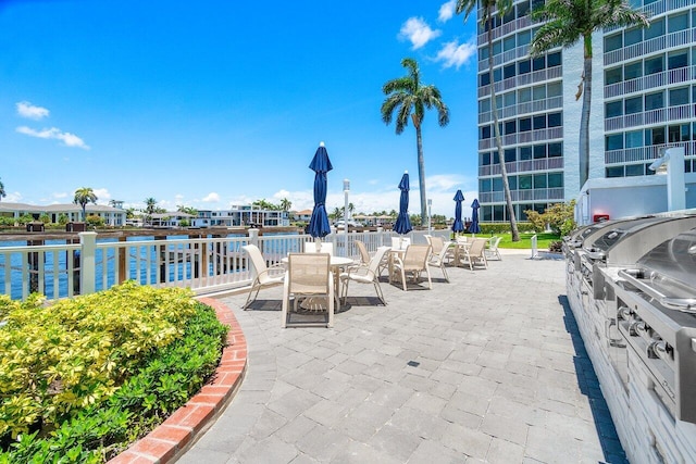 view of patio with a water view